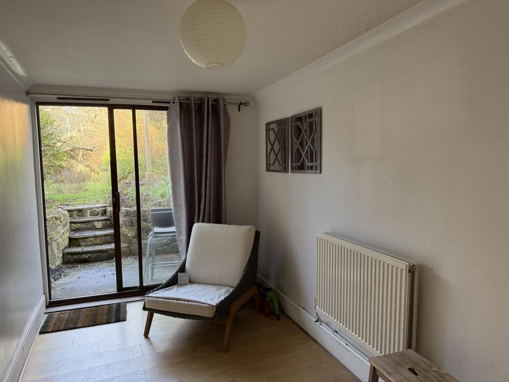 Lot: 125 - END-TERRACE TWO-BEDROOM HOUSE WITH REAR GARDEN FOR UPDATING - General view of the dining room